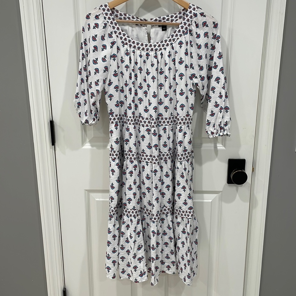 Worn once. White with blue/red flowers. Size XS but fits more like a small.